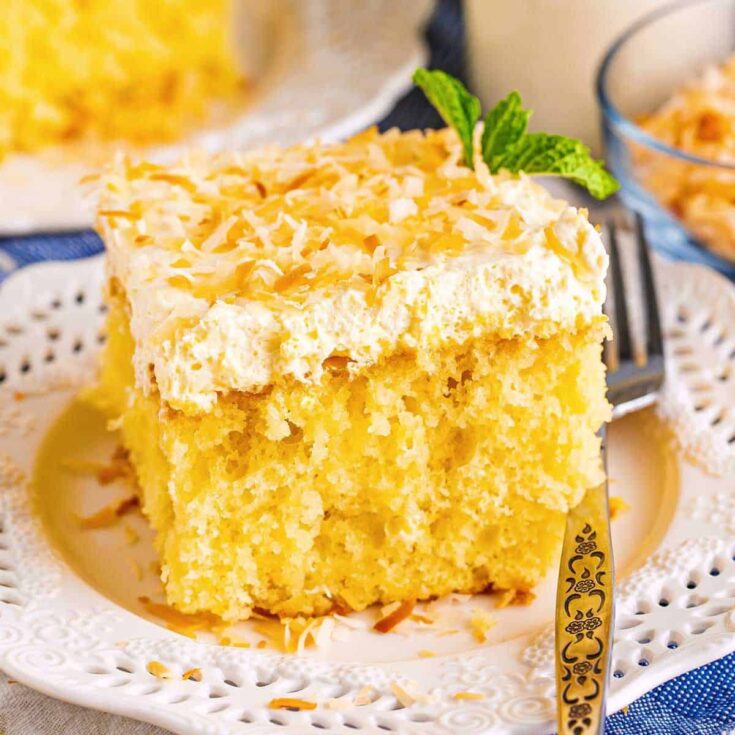 A slice of Pina colada poke cake