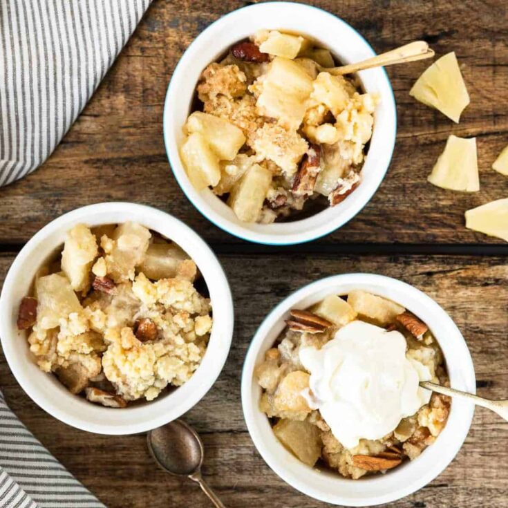 Three bowls of pineapple pecan dump cake