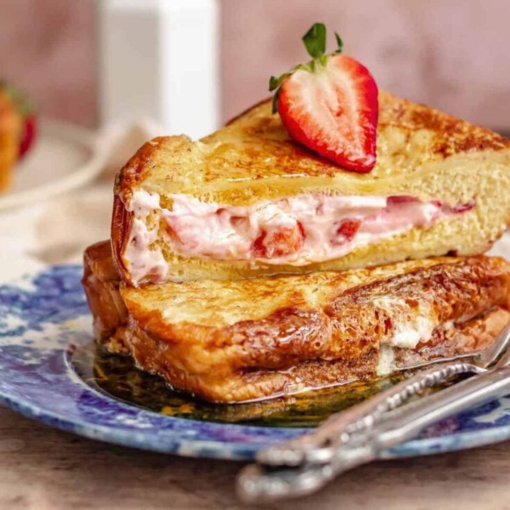 A plate of strawberry stuffed French toast