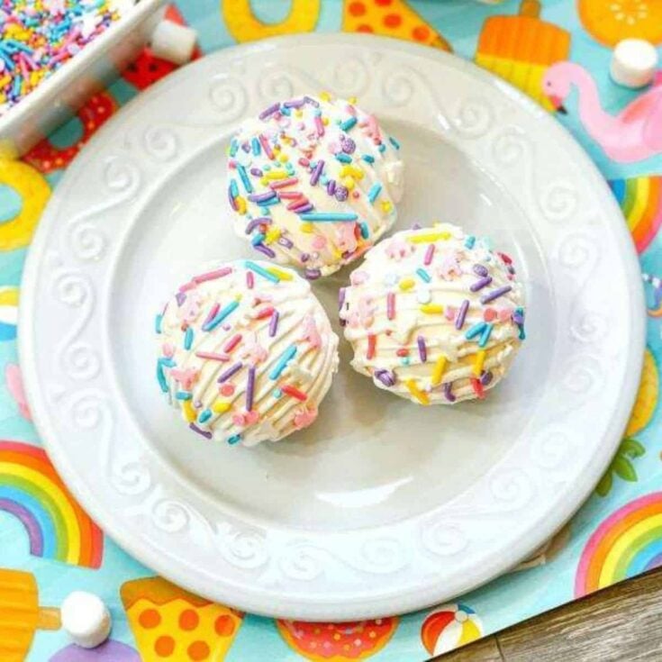 Unicorn hot chocolate bombs on a plate