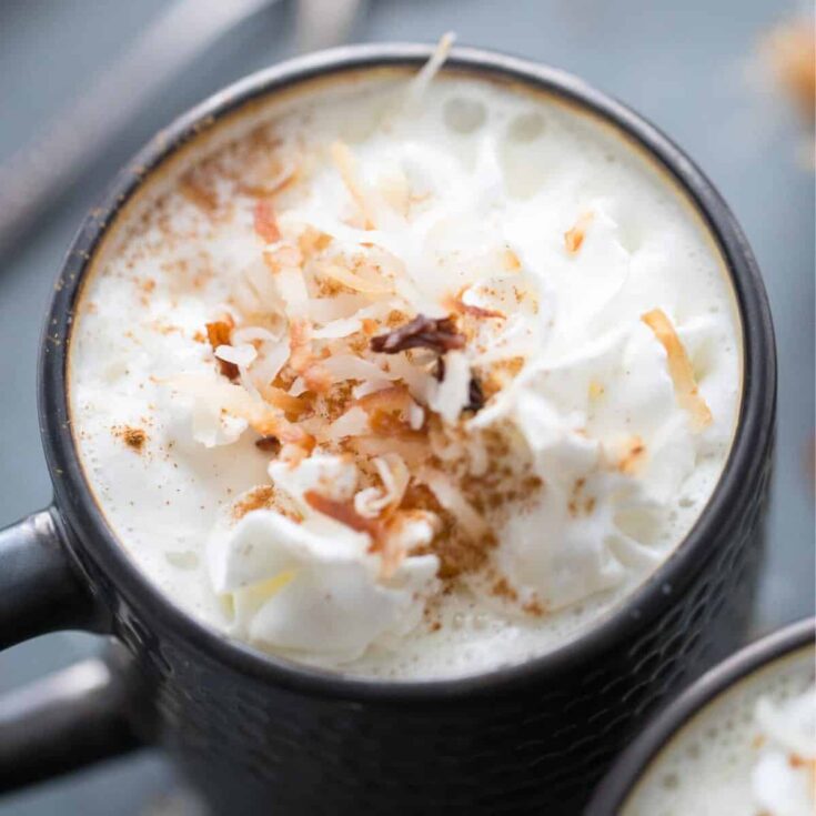 Coconut white hot chocolate topped with shaved coconut