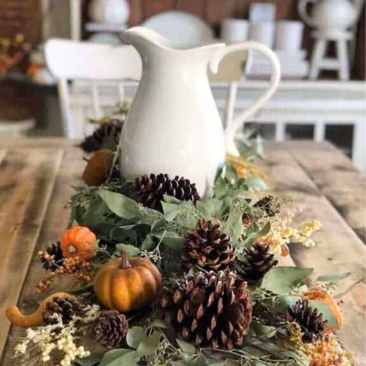 pinecone, pumpkin and foliage fall table decoration