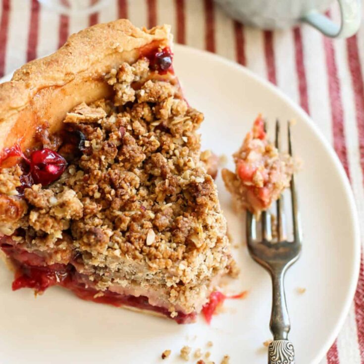 A slice of apple cranberry pie