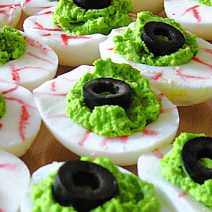 Deviled egg eyeballs topped with black olives