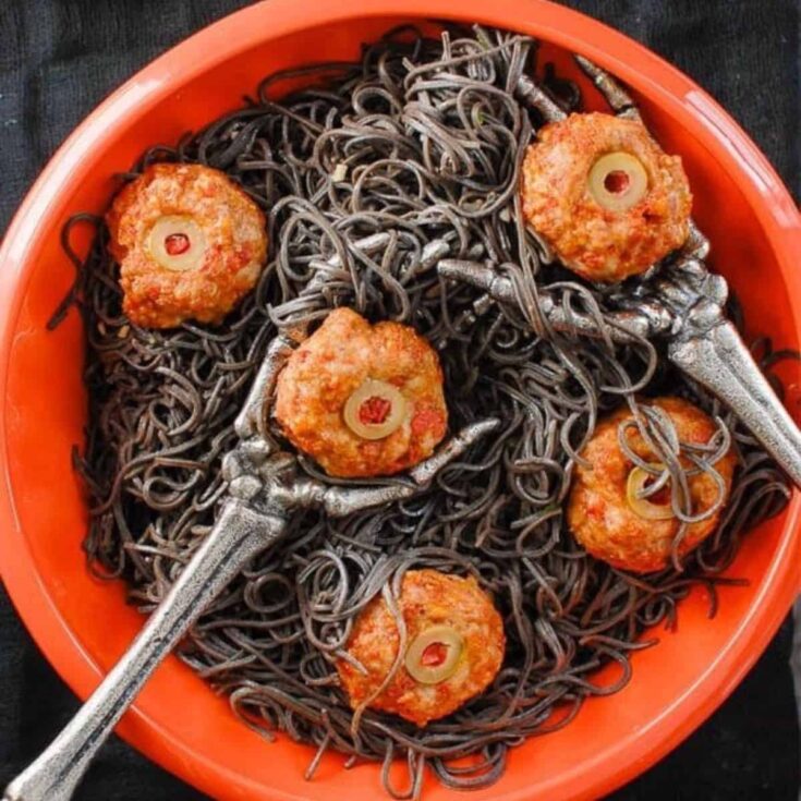 Diablo eyeballs and black bean pasta in a bowl