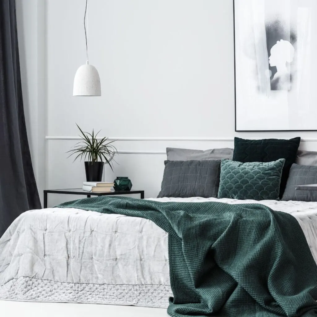 A bedroom designed with green accent