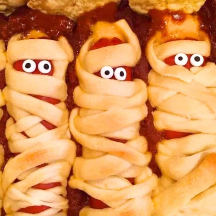 Hot dog mummies in a chili graveyard