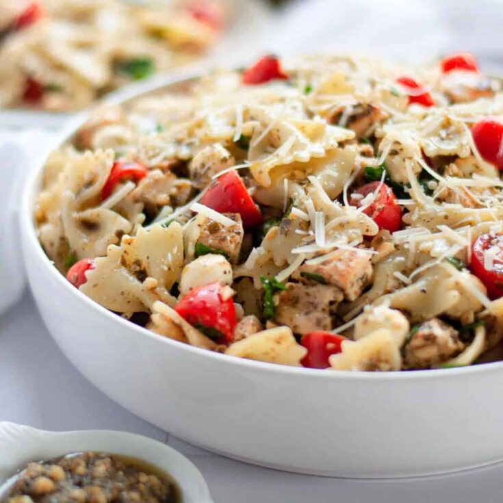 Pesto pasta salad with chicken in a bowl