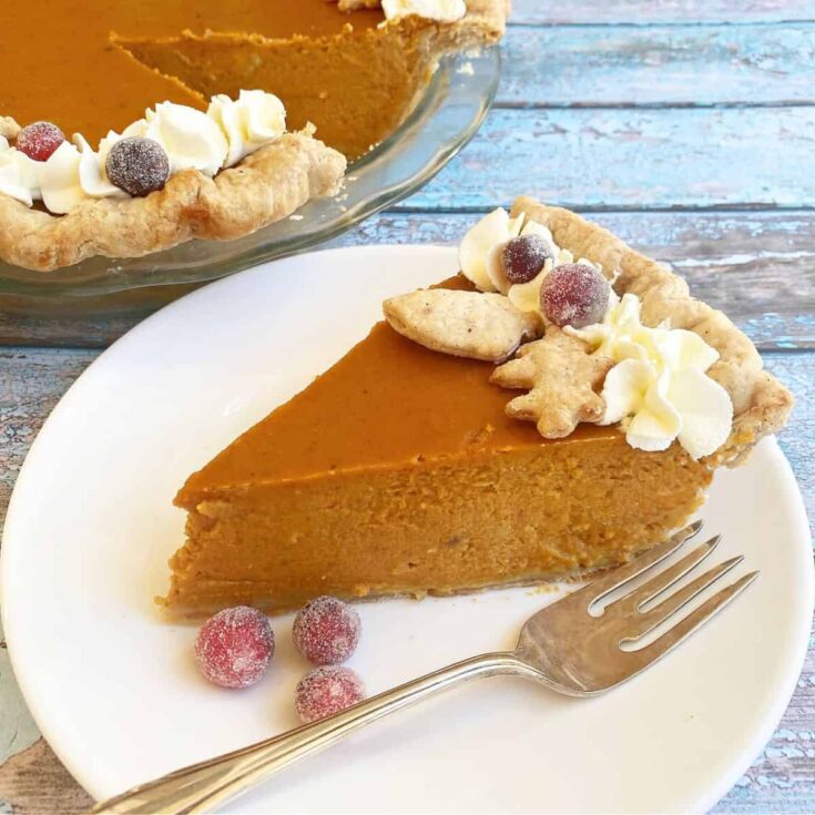 Triple ginger pumpkin pie&nbsp;topped with berries and biscuits