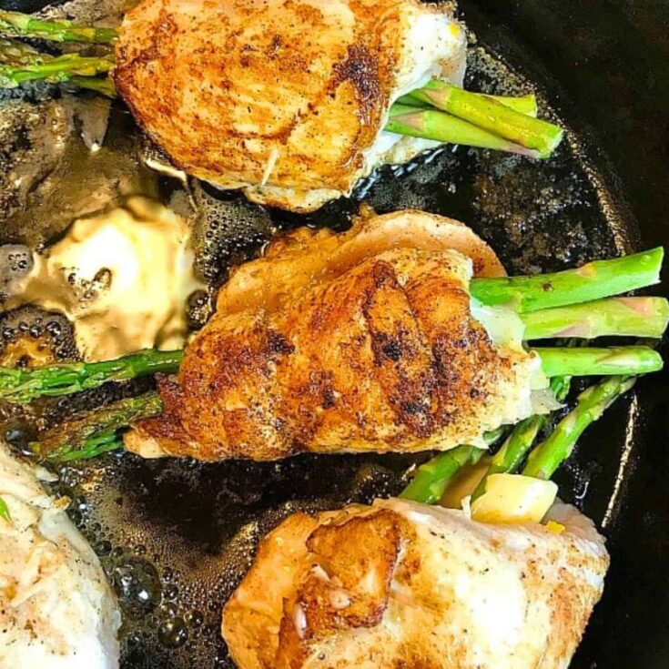Asparagus stuffed chicken on a pan