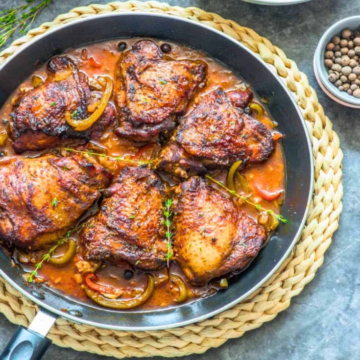 Authentic Jamaican brown stew chicken on a pan
