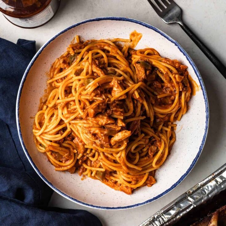 BBQ spaghetti served on a plate after reading these Leftover pulled pork recipes