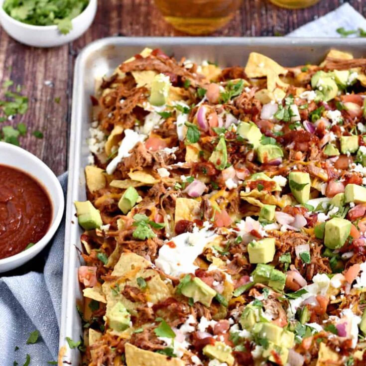 A tray of leftover pulled pork nachos