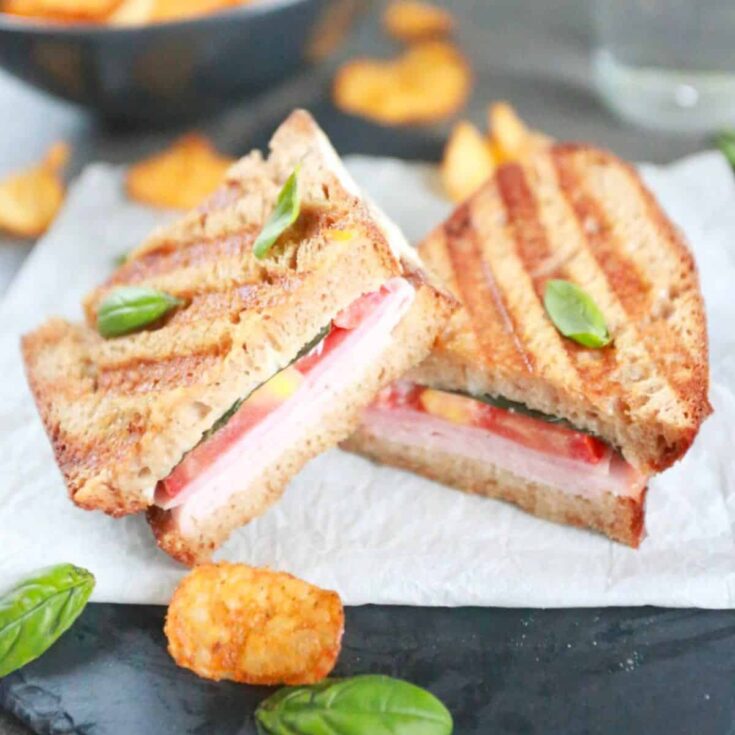 Panini sandwich with ham and tomatoes
