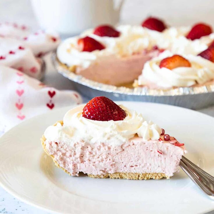 A slice of strawberry whipped cream pie