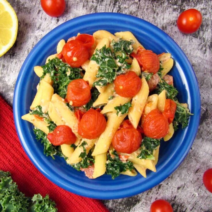 A plate of Vegan tomato ricotta pasta with kale