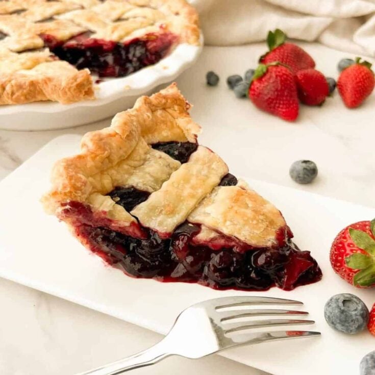 A slice of blueberry strawberry pie