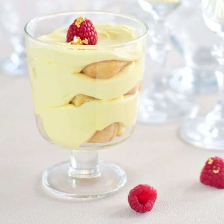 Champagne tiramisu topped with a fresh raspberry