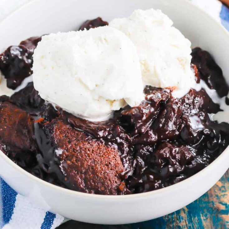 One bowl of chocolate cobbler topped with vanilla ice cream