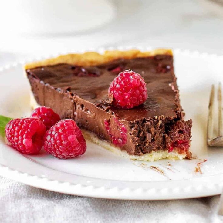 A slice of chocolate raspberry tart gourmet dessert