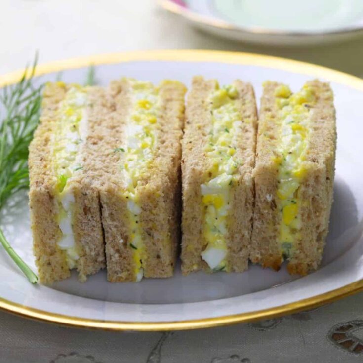Four egg salad picnic sandwiches