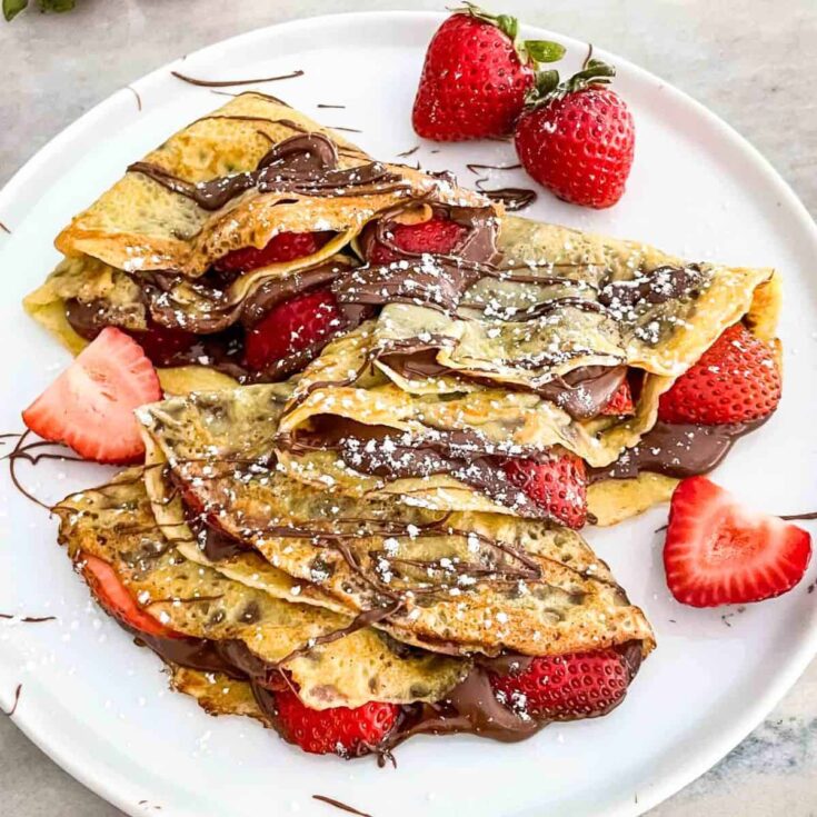 Strawberry Nutella crepes on a plate