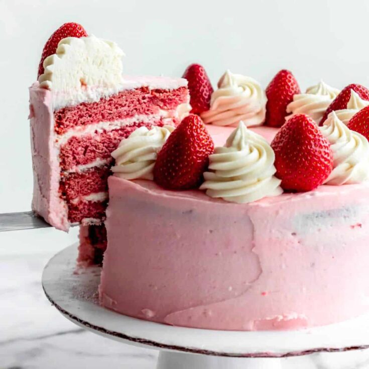 Strawberry cake with cream cheese frosting and fresh strawberries
