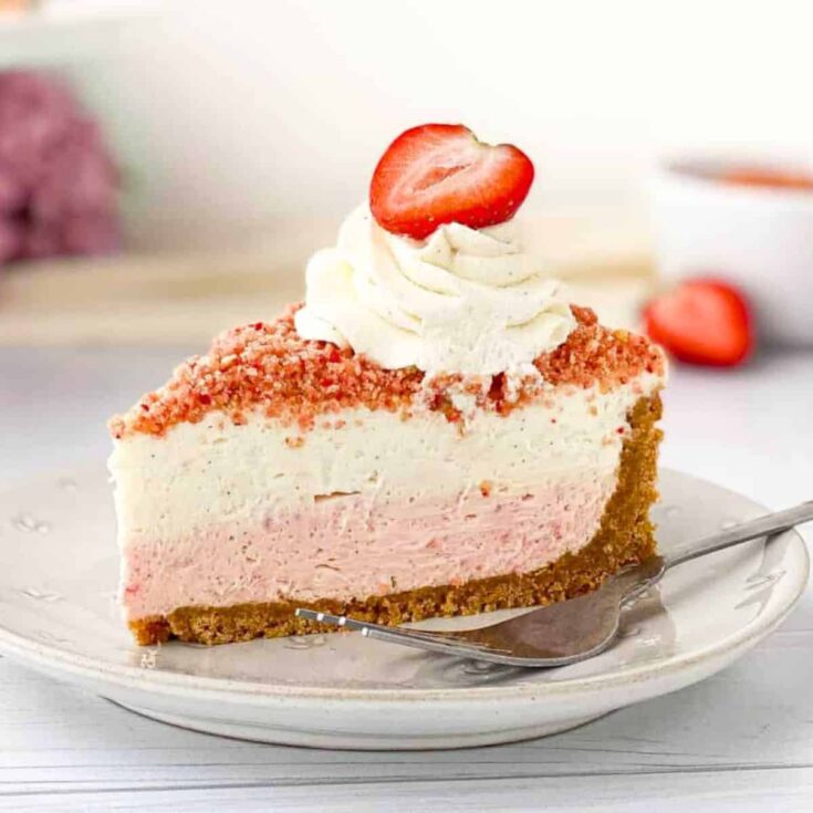 A slice of strawberry crunch cheesecake