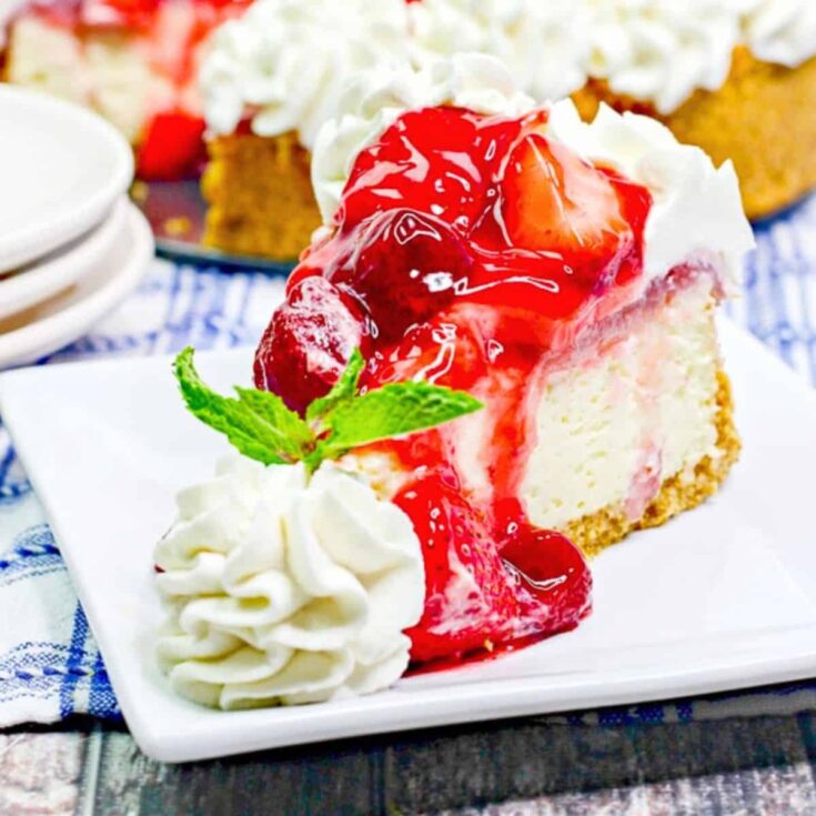 A slice of the ultimate strawberry cheesecake dessert