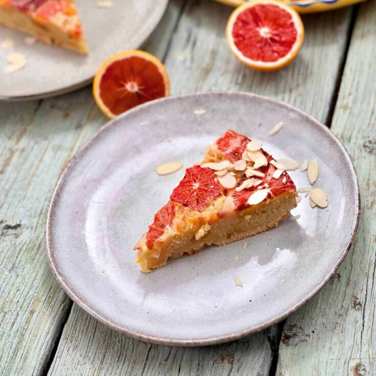 A slice of blood orange olive oil cake with rosemary
