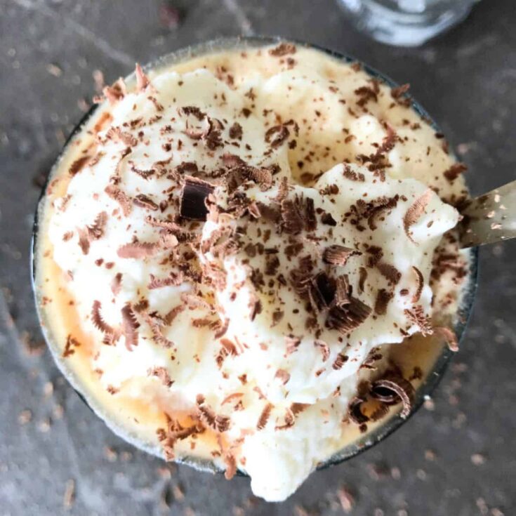 Cold brew iced coffee topped with shredded chocolate