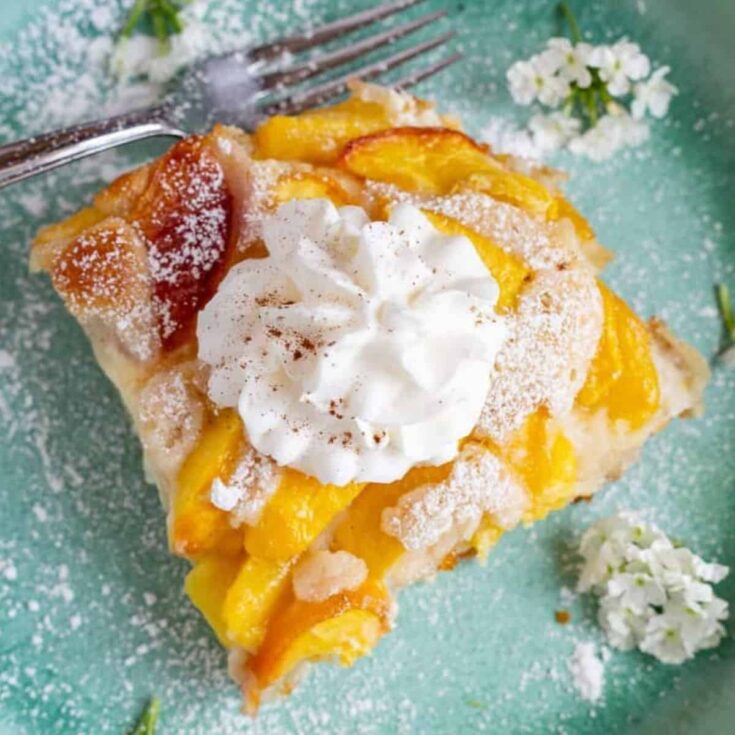 A plate of cream cheese peach cobbler