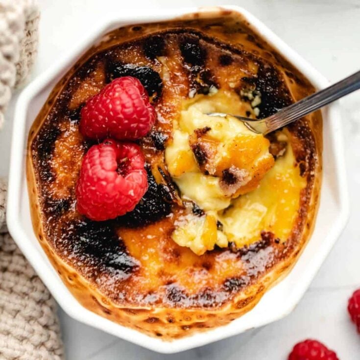 Creme brulee topped with fresh raspberries