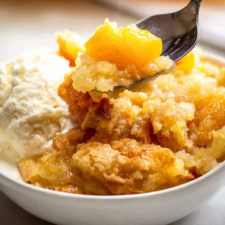 A bowl of peach dump cake