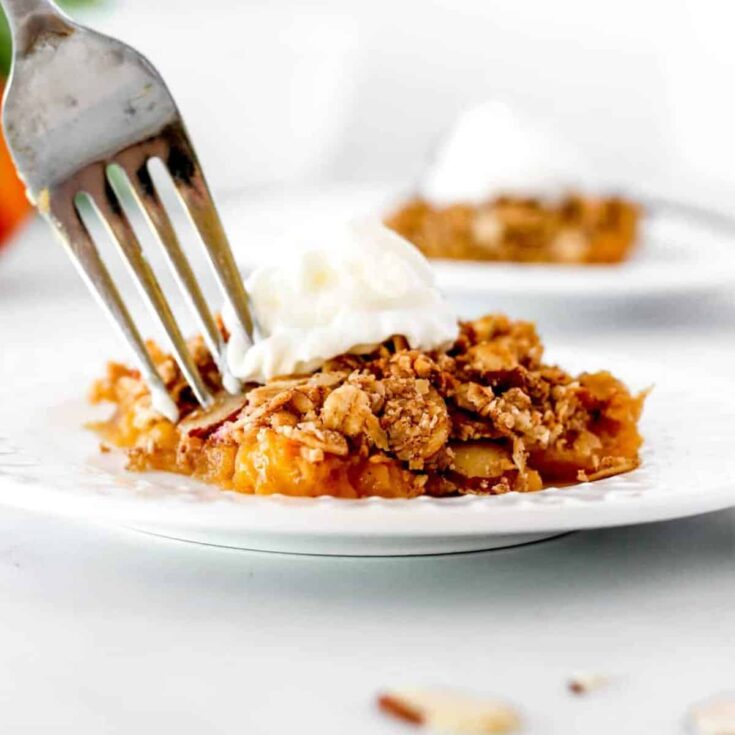 A plate of peach crisp with oatmeal