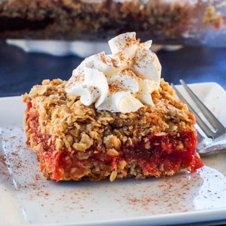 Rhubarb squares topped with whipped cream