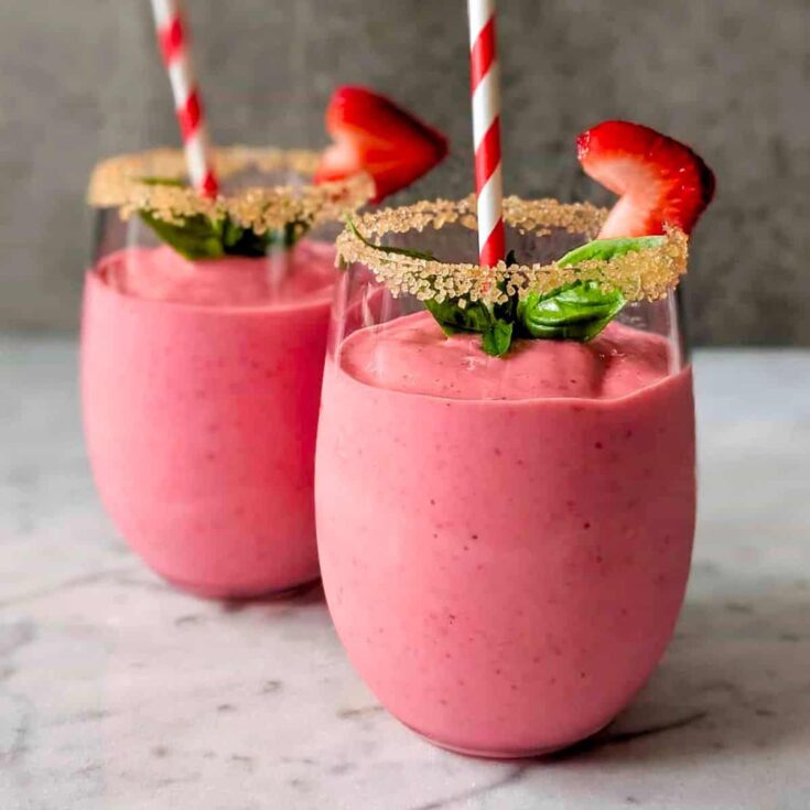 Two servings of rhubarb strawberry smoothies
