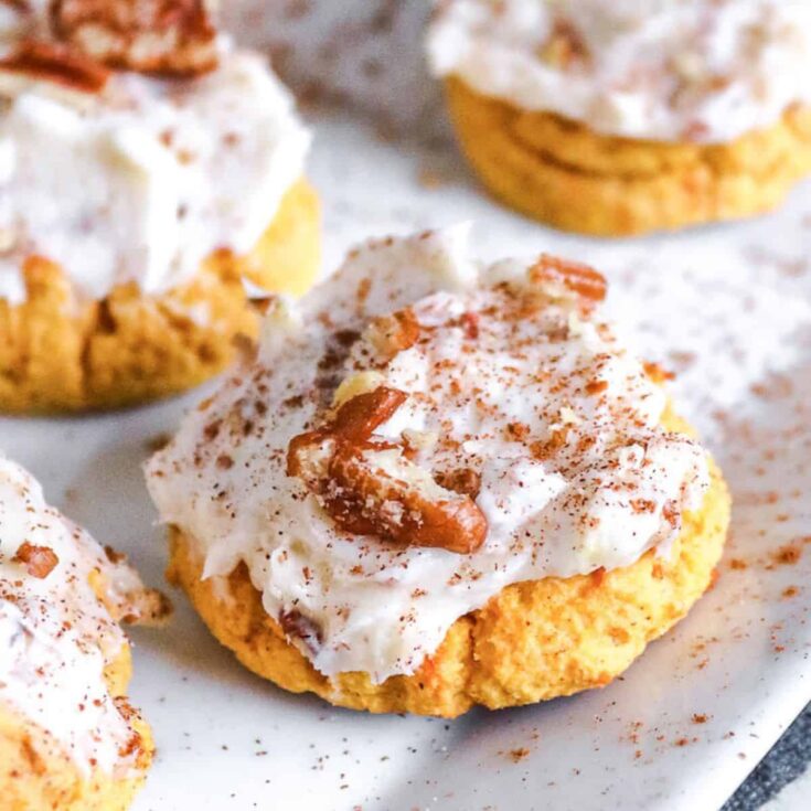 Fluffy pumpkin cookies topped with cream cheese frosting