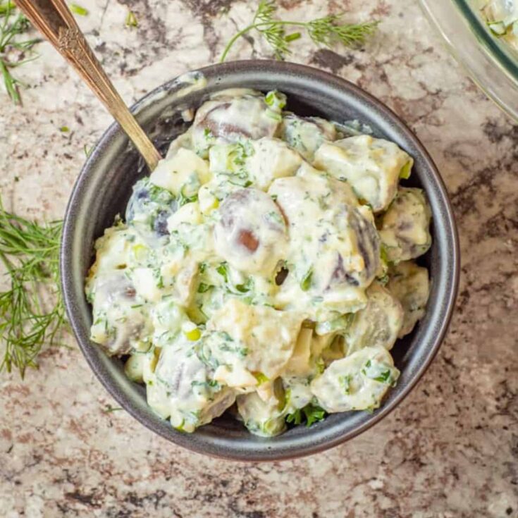 A bowl of Greek yogurt potato salad