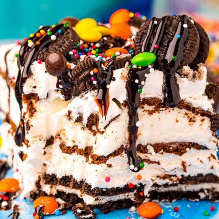 Oreo ice cream cake with ice cream sandwiches topped with sprinkles