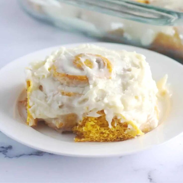 Pumpkin spice cinnamon rolls on a plate