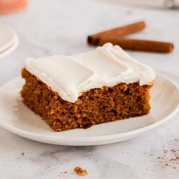 A slice of sheet pan pumpkin spice cake bars