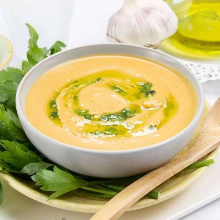 A bowl of butternut squash soup with cream cheese