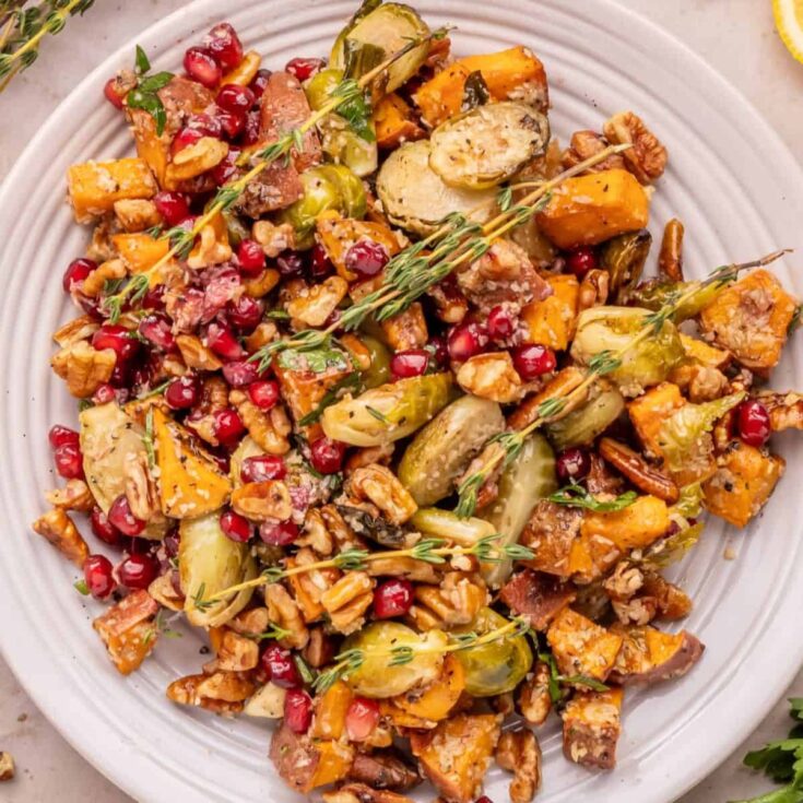 A plate of roasted sweet potatoes and Brussel sprouts