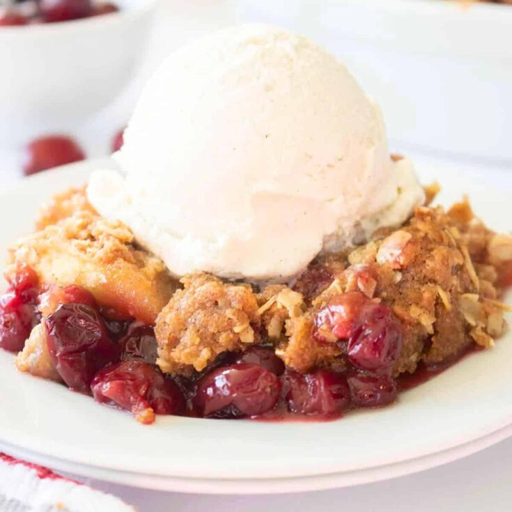 Apple cranberry crisp topped with ice cream