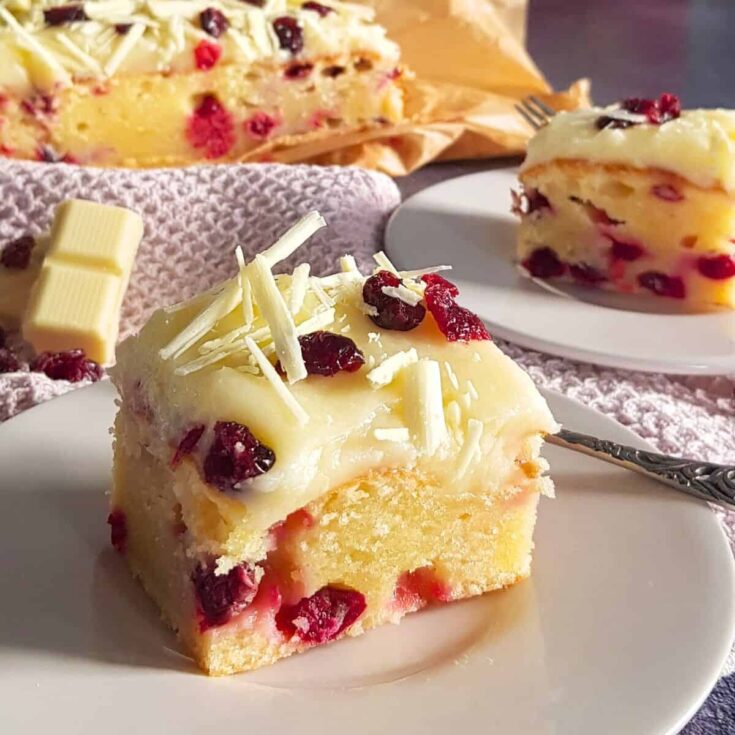 A slice of Christmas sheet cake cranberry dessert