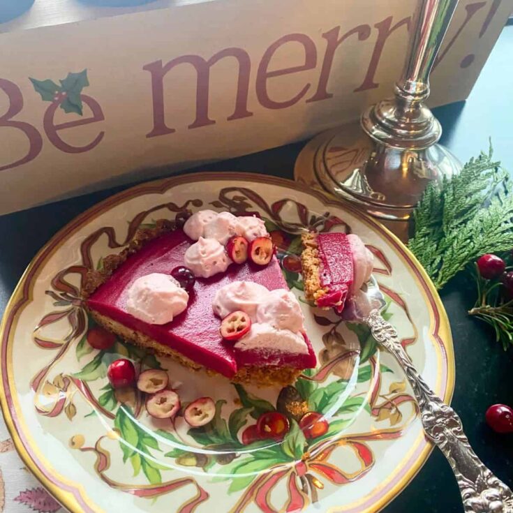 A slice of cranberry curd tart with almond crust