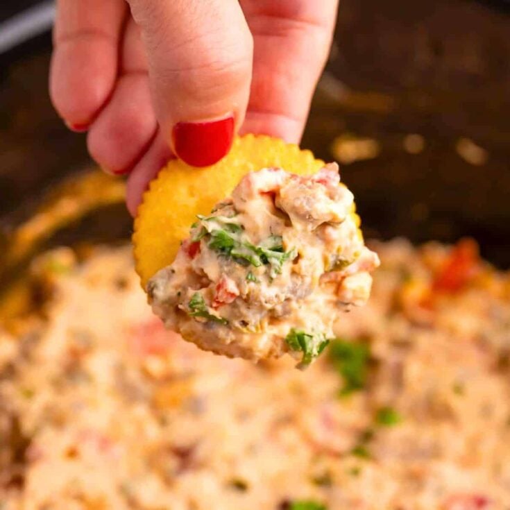 Biscuit dipped in crockpot pizza dip