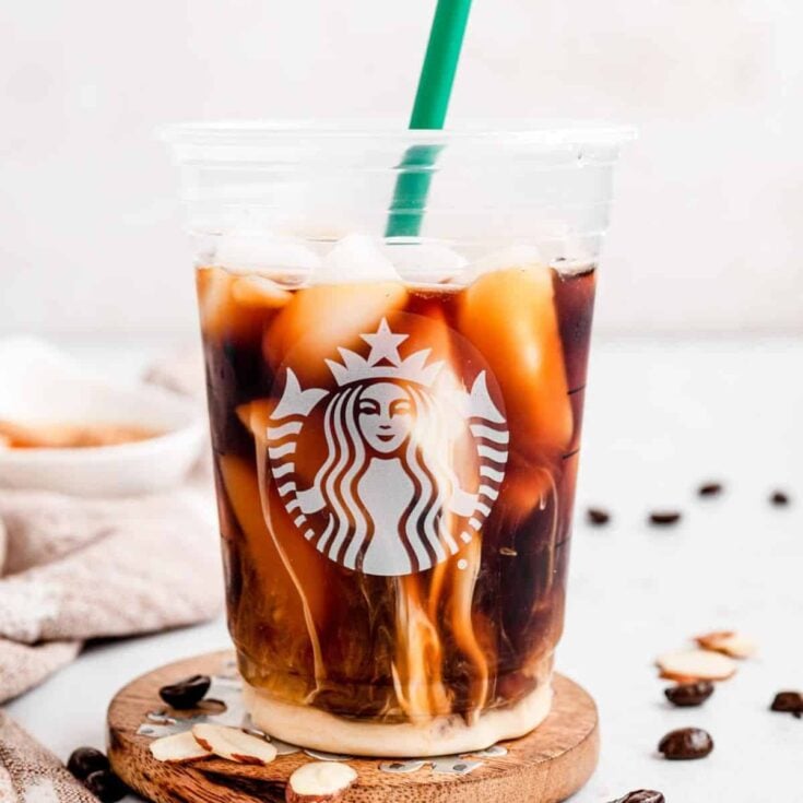 Honey almond milk cold brew in a Starbucks cup