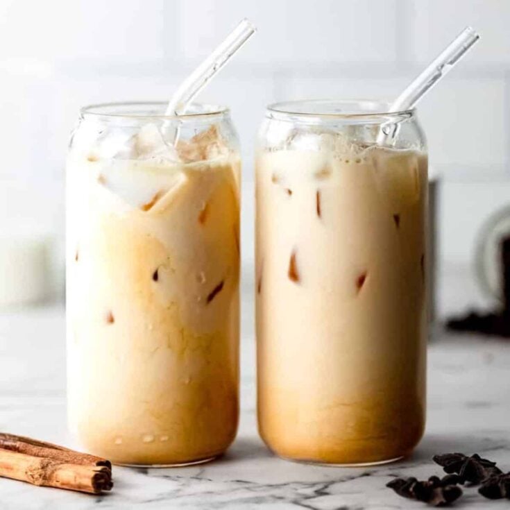 Two glasses of iced dirty chai latte coffee